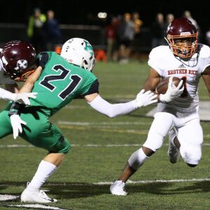 Brother Rice’s Jahlil Pettis (1) picks up yardage. Allen Cunningham/For the Sun-Times.