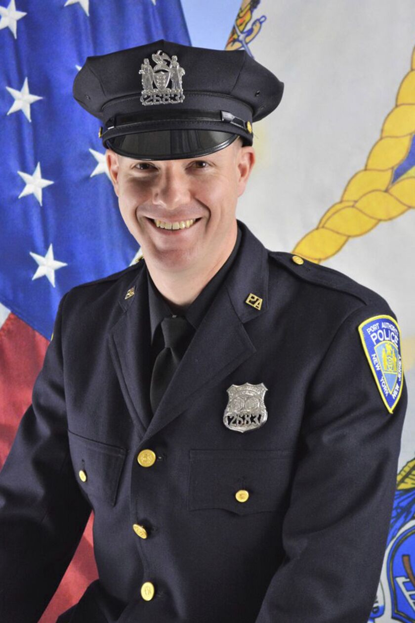 This photo, provided by the Port Authority of New York & New Jersey on Wednesday shows Port Authority Officer Jeffrey Croissant. Croissant and Dr. Mehmet Oz came to the aid of a traveler and performed CPR at Newark Liberty International Airport, Monday night.