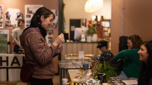 U.S. Rep. Lindsey LaPointe, left, tries a product at Wildlight Yoga’s Mindful Market in the Portage Park neighborhood on the Northwest Side, Saturday, Nov. 29, 2025.