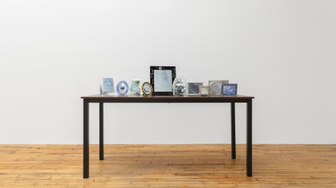 Prints, frames, table; Ether, 2024; Hélène Fauquet