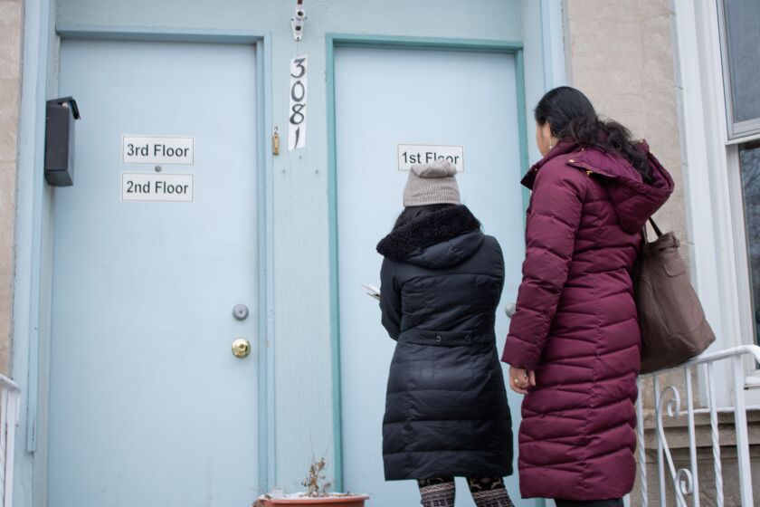 Grace Chan, left, and Michelle Gan knocked on homes in Bridgeport to tell residents about the upcoming 2020 census.