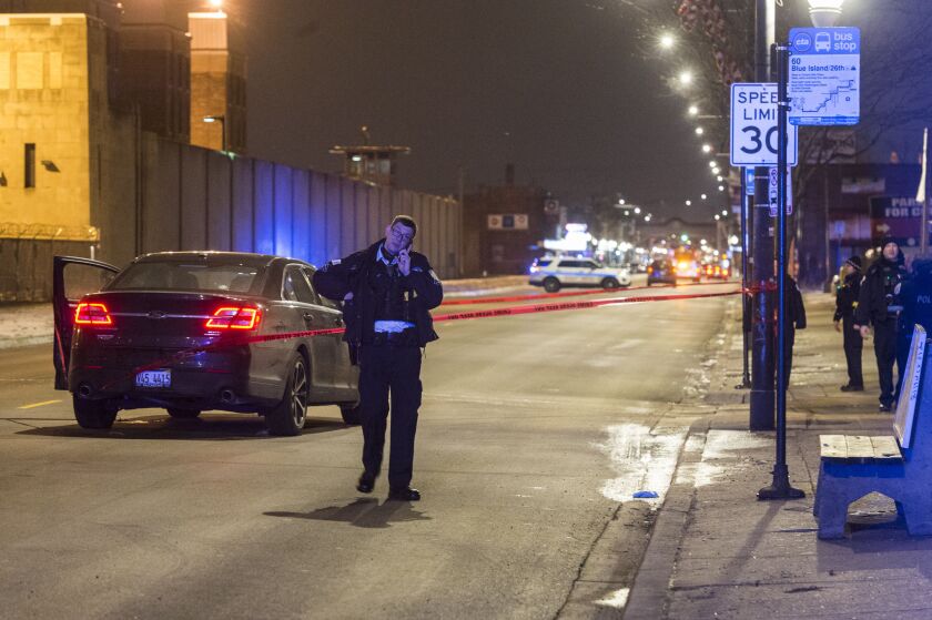 Police investigate a car outside the Cook County Jail after a man was shot while driving a few blocks away in the Little Village neighborhood on the Southwest Side. | Tyler Lariviere/Sun-Times