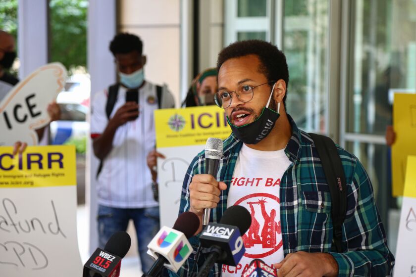 Kobi Guillory, with the Chicago Alliance Against Racist and Political Repression, speaks with the media during a protest outside the Immigration and Customs Enforcement office at 101 W. Ida B. Wells Dr in South Loop, Tuesday, Aug. 4, 2020.