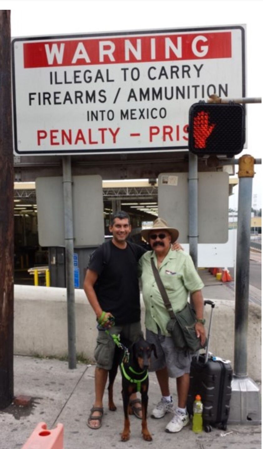 The Garrridos as they crossed the Mexican border into the United States with rescue dog Pedro.