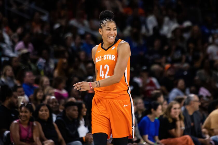 Chicago Sky’s Candace Parker laughs after flopping during the 4th period of the WNBA All-Star basketball game Sunday afternoon at Wintrust Arena.