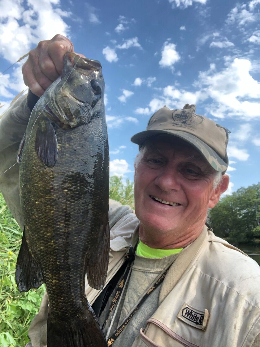 George Peters with a Kankakee River smallmouth bass before the high waters came. Provided photo