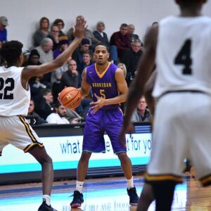 Waukegan’s Jordan Brown (5) waits at the top of the key. Worsom Robinson/For the Sun-Times.