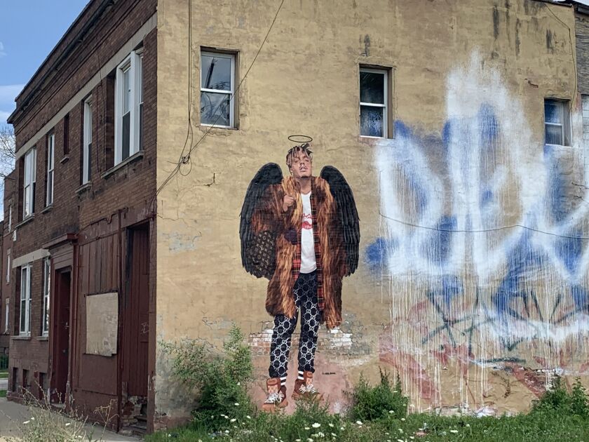 Chris Devins painted his Juice WRLD mural on the side of a building at 737 W. 59th St.