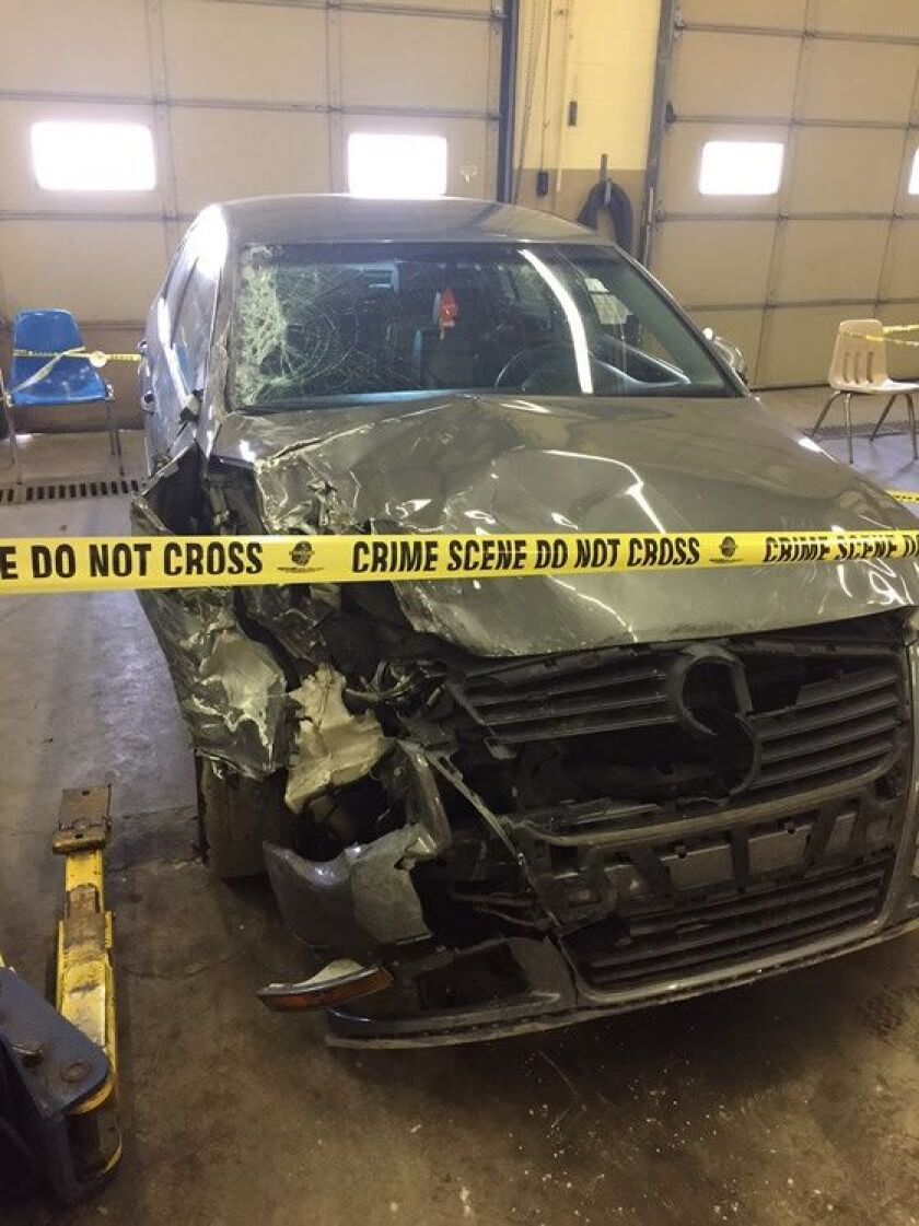 A Volkswagen Passat was heavily damaged when the driver crashed into a rolled-over SUV and struck a man in northwest Indiana. | Indiana State Police