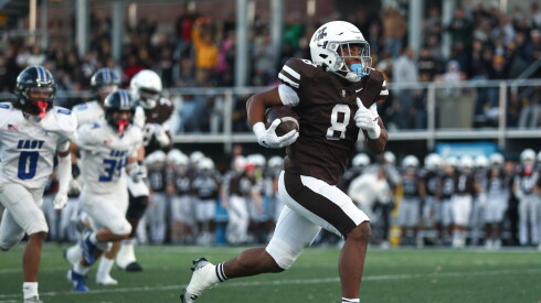 Mount Carmel's Nathan Samuels (8) runs for a touchdown against Lincoln-Way East.