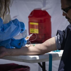 Mike Grono, 45, of Chicago’s Norwood Park neighborhood, gets his blood drawn for a coronavirus antibody test by a Simple Laboratories phlebotomist at the lab’s drive-thru testing site in the parking lot of St. Rosalie Catholic Parish in Harwood Heights, Friday, May 1, 2020.