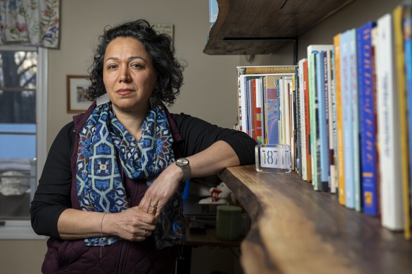 Nassim Abdi an Iranian-American with a Ph.D. sits in her home officer, Monday, Jan. 12, 2026, in Munster, Ind. | Tyler Pasciak LaRiviere/Sun-Time
