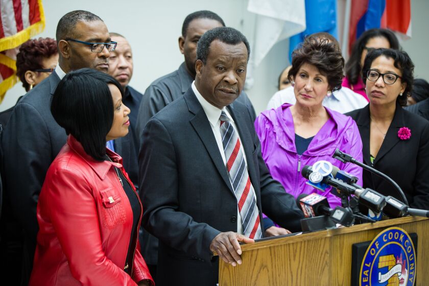 Willie Wilson, center, announcing in March he’s contributing $150,000 to a new relief fund to help people delinquent on their property taxes. | Santiago Covarrubias / Sun-Times
