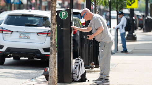 A driver pays for parking on ParkChicago’s meter on North Clark Street in Andersonville, Tuesday, Sept. 15, 2026.