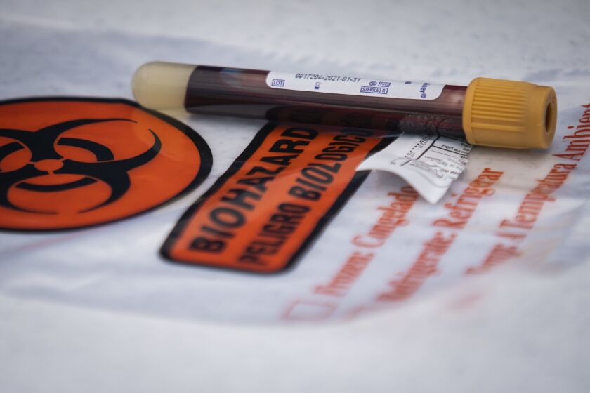 A blood sample drawn during drive-thru testing at St. Rosalie Catholic Church in Harwood Heights.