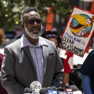 Laurentio Howard, who has filed a federal civil rights lawsuit after his daughter was shoved and dragged by a Chicago Police officer stationed at Marshall Metropolitan High School, speaks during a Chicago Teachers Union rally in Federal Plaza in the Loop, Wednesday afternoon, June 24, 2020. The union and supporters are calling for the Chicago Board of Education to vote to end a $33 million contract between Chicago Public Schools and the Chicago Police Department.