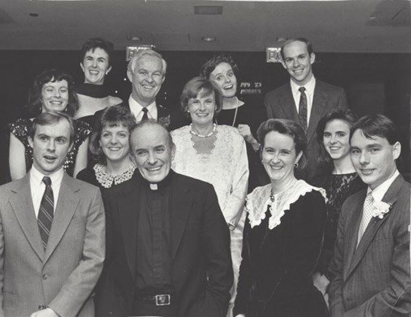 Mary Jule Greeley Durkin and her husband Jack surrounded by their family. Her brother, Rev. Andrew Greeley, stands in front of her. | Provided photo