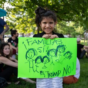Quetzalli Oritz, 5, holds a handmade sign in support of reuniting families separated by ICE, at a march in Harrison Park, Pilsen on June 29, 2018. I Maria de la Guardia/Sun-Times