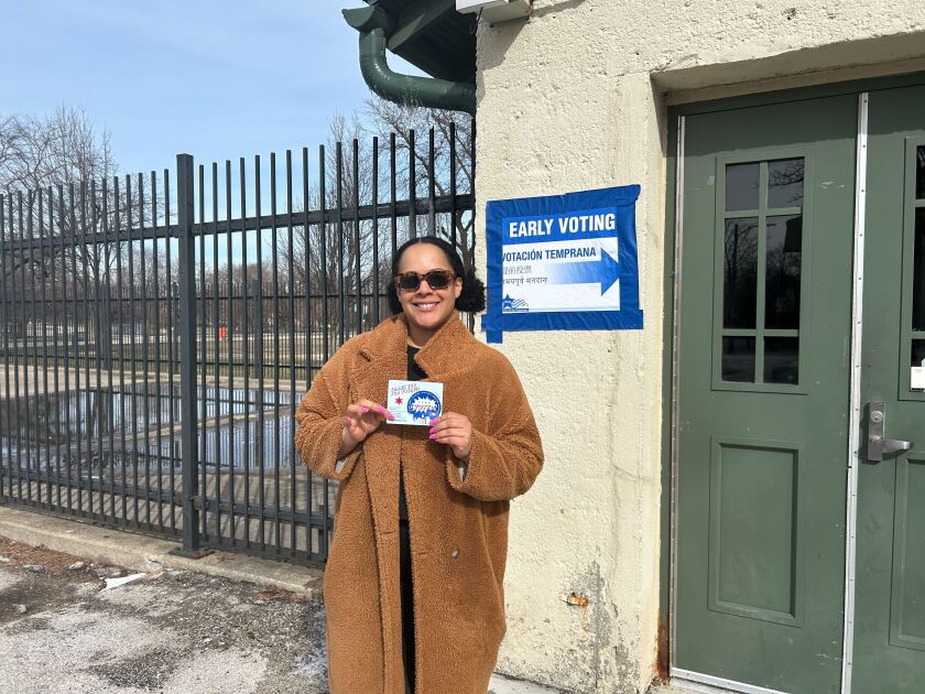 Khrysta Hendricks poses for a photo after voting.