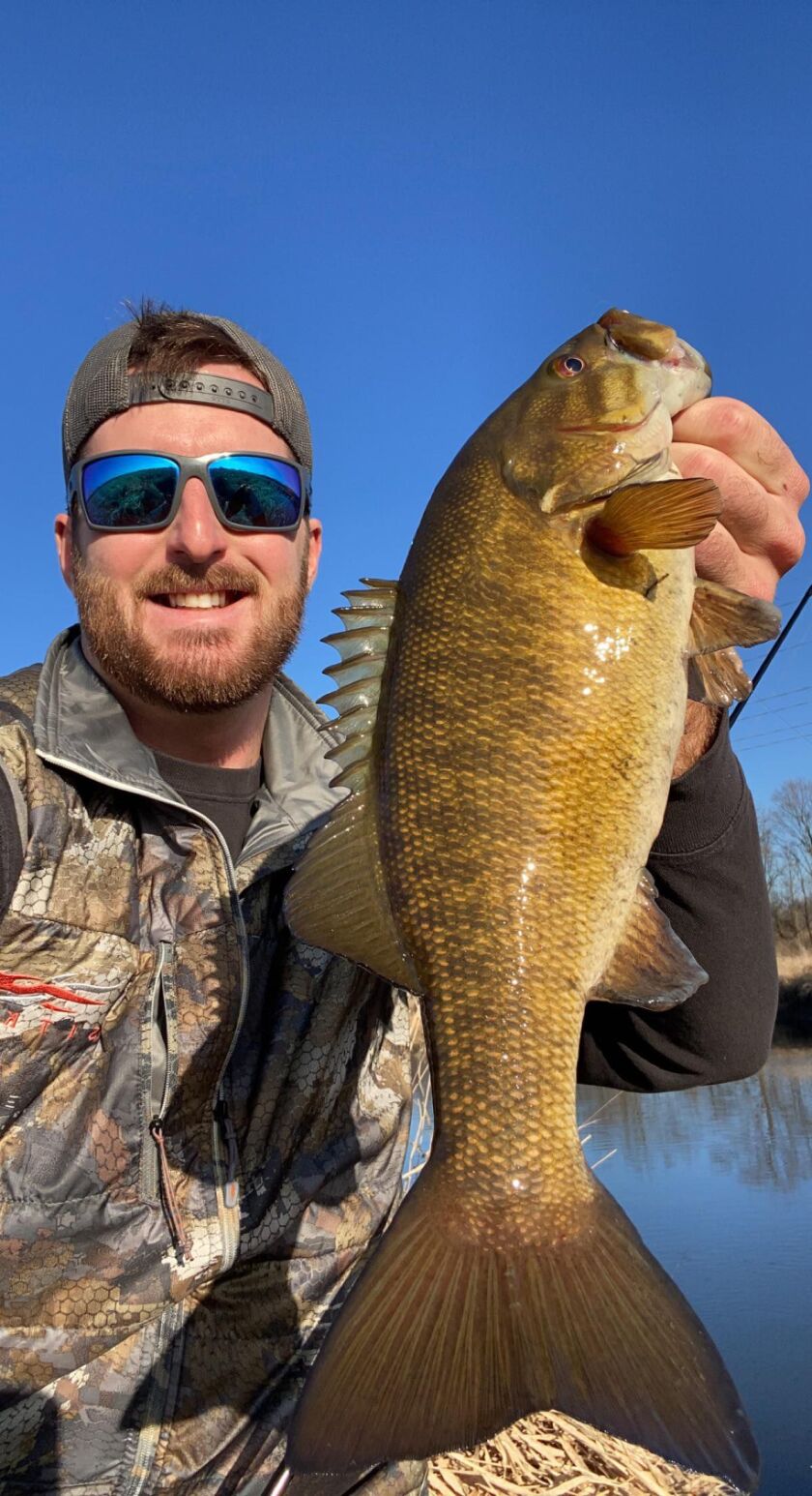 Capt. A.J. Cwiok with a good smallmouth bass from the DuPage River. Provided photo