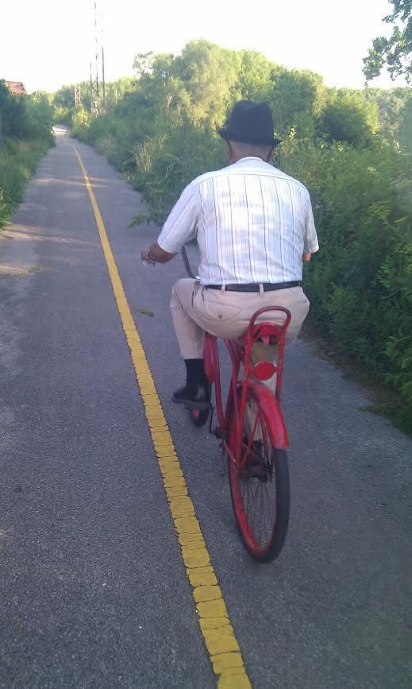 Rev. James Bass riding a bicycle at 94. | Provided photo