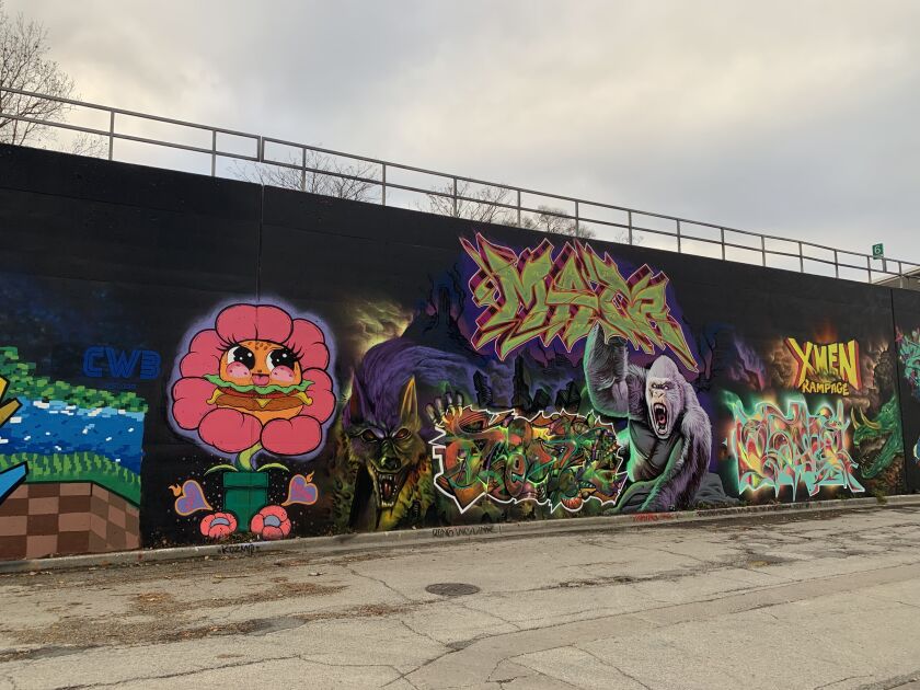 The hamburger flower character was made by artist KOZMO. The King Kong-like gorilla on the right, made by the X-Men graffiti team, was inspired by the Rampage franchise.