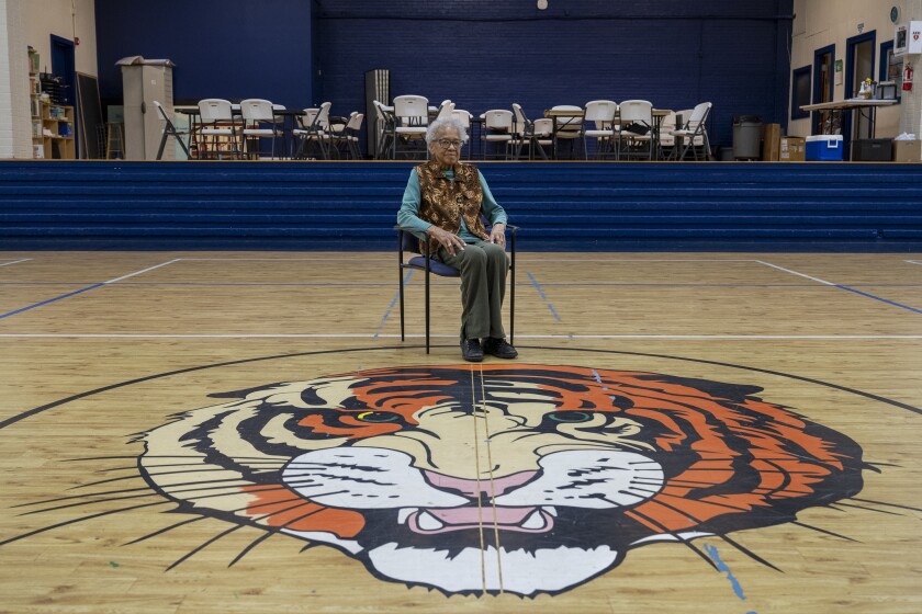 Peggy Baxter in the original gym of Sterling High School, where she and a young Jesse Jackson graduated. It is now part of the Sterling Community Center.