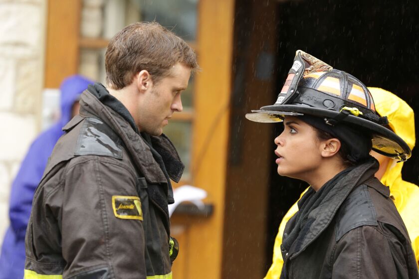 Jesse Spencer and Monica Raymund in Chicago Fire. ORG XMIT: Season: 3
