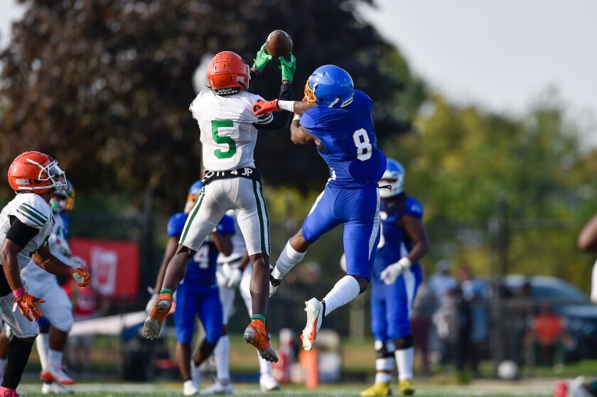Morgan Park’s Jonas Lee (5) intercepts a pass intended for Simeon’s Malik Elzy (8) in the final minute of the game.