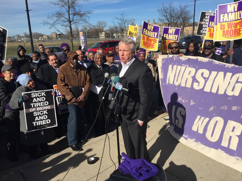 Chris Kennedy speaks to union members outside a nursing home at 69th and Wentworth after picketing with SEIU-Healthcare workers. Photo by Mark Brown