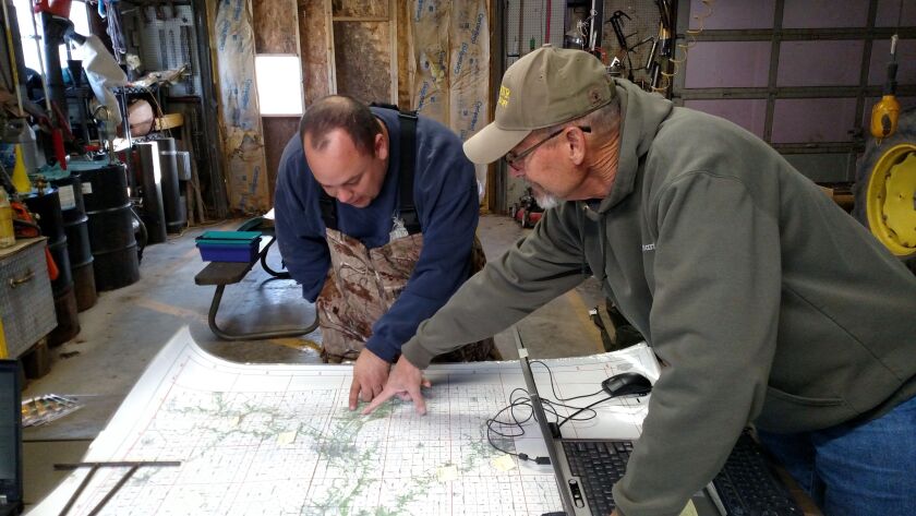Another advantage of having deer check-in stations in counties with chronic wasting disease is the ability of Illinois Department of Natural Resources staff to pinpoint where deer were shot, such as Mike Smith showing deer program manager Tom Micetich at