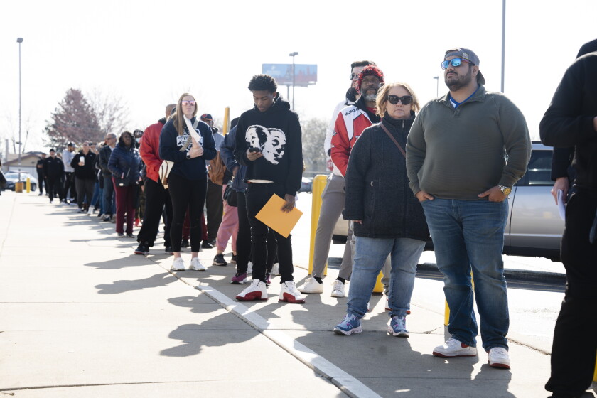 People stand in line at the Chicago West Secretary of State Facility to apply for a Real ID, Saturday, April 12, 2025. | Pat Nabong/Sun-Times