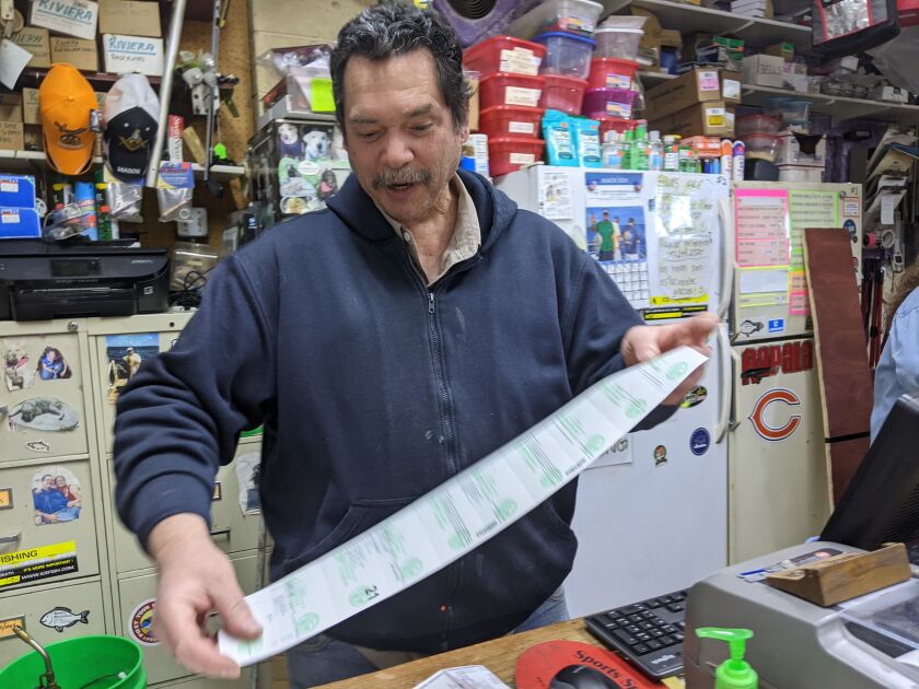 Capt. William “Augie” Ralph, who passed away last week, printed out my license at the Salmon Stop bait/tackle shop in Waukegan this spring. Credit: Dale Bowman