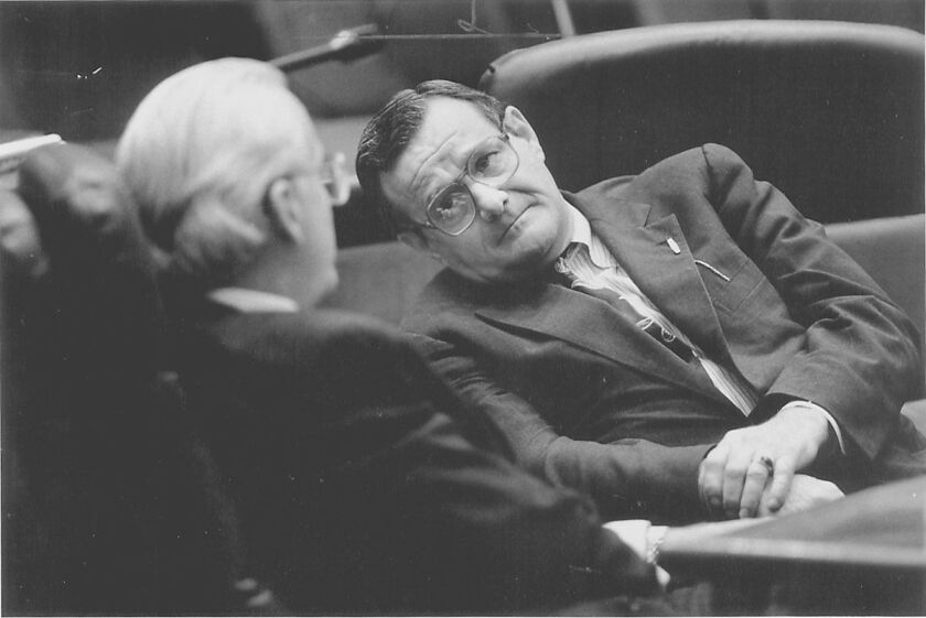 Ald. Burton Natarus, right, talks with Ald. Edward M. Burke (14th) at City Council budget hearing in 1991.