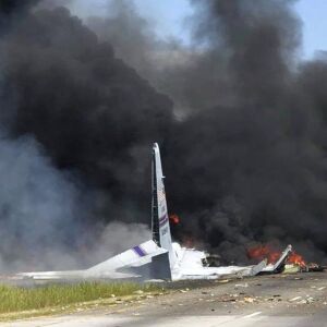 Flames and smoke rise from an Air National Guard C-130 cargo plane crashed. | James Lavine via AP