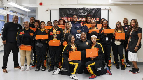 The North Lawndale Phoenix flag football team and school staff at North Lawndale College Prep
