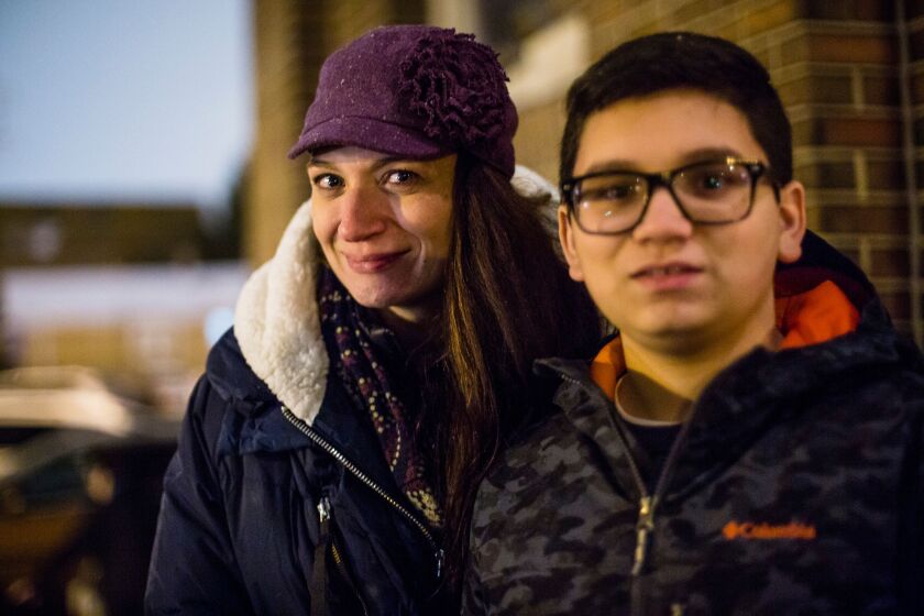 Griselda Silva with her son, Sebastion Ayala, of Santa Lucia parish, outside St. Barbara’s church after officials announce plans to close or consolidate parishes in Bridgeport, Canaryville and Chinatown, Wednesday, Nov. 28, 2018. | James Foster/For the Su