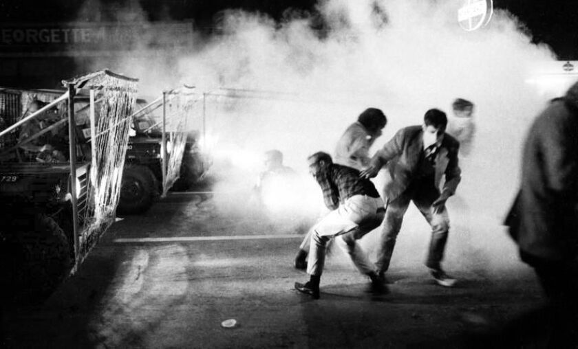 Soldiers using tear gas and barbed wire strung on Jeeps pushed protesters up Michigan Avenue from 18th Street during the convention. | Duane Hall / Sun-Times