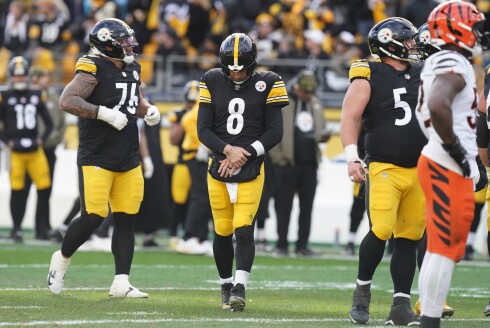 Pittsburgh Steelers quarterback Aaron Rodgers (8) holds his arm after a hit by the Cincinnati Bengals during the first half Sunday, Nov. 16, 2025, in Pittsburgh.