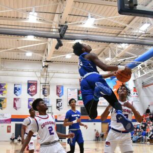 Bloom’s Keshawn Williams (11) leaps to the basket over Curie, Saturday 12-29-18. Worsom Robinson/For Sun-Times