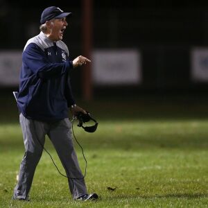 Lisle’s coach Paul Parpet leads the Lions to a victory over Streator. | Allen Cunningham / for Chicago Sun-Times