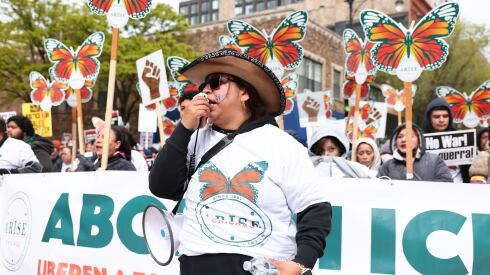Flor Ramirez leads at chant at the May Day rally.