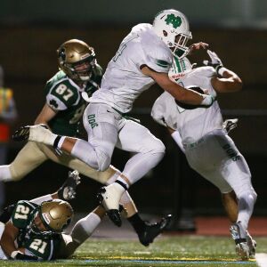 Notre Dame’s Ty Gavin jumps over a St. Patrick defender. Allen Cunningham/For the Sun-Times.
