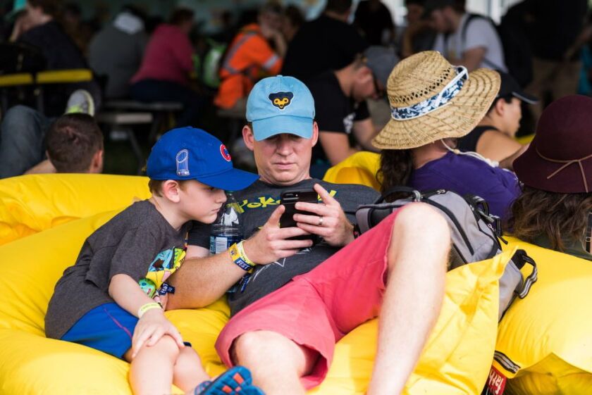 Stephen Whatley and his son Jack from Rogers, Arkansas, at the Pokémon Go Fest. | Max Herman/Sun-Times