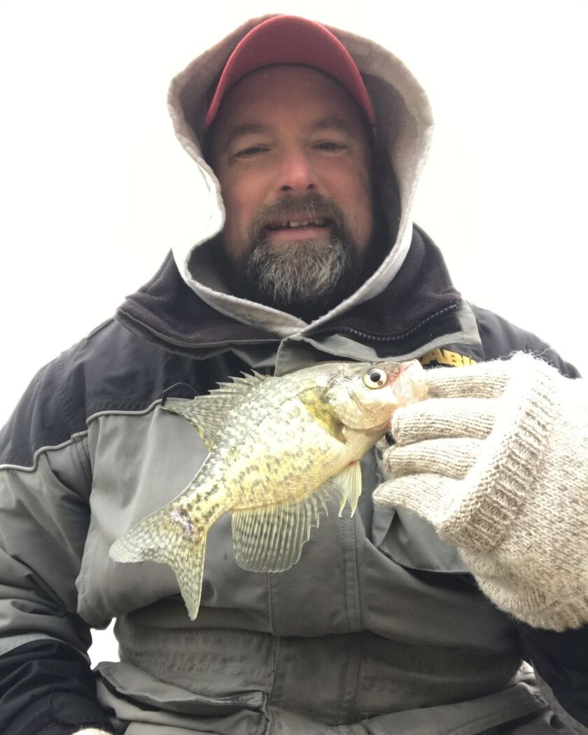 Ken “Husker” O’Malley with a crappie caught before ice-up. Provided photo
