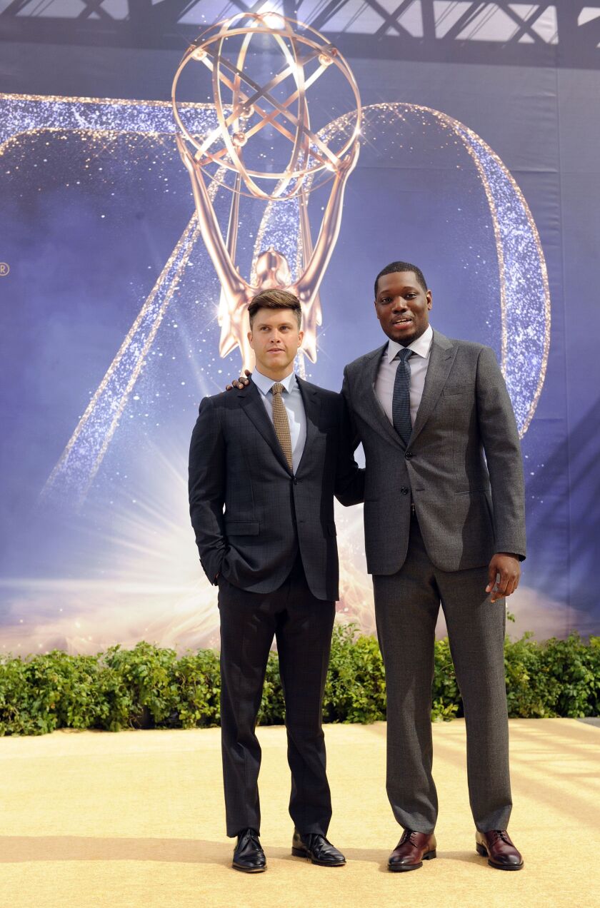 Colin Jost (left) and Michael Che, co-hosts for the 70th Emmy Awards, are photographed Thursday, Sept. 13, 2018, in Los Angeles. | Chris Pizzello/Invision/AP
