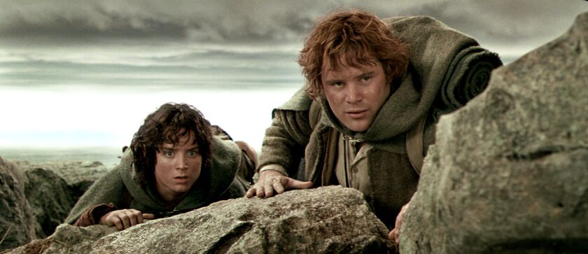 Frodo (Elijah Wood) and (left) Sam (Sean Astin) cautiously approach the black gates of Mordor in “The Lord of the Rings: The Two Towers.”