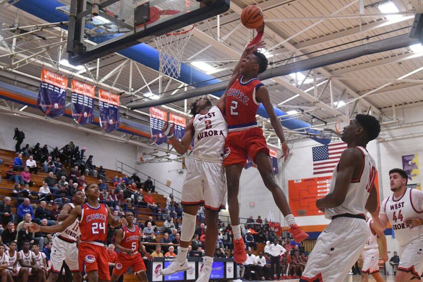 West Aurora’s Cam Donatlan (2) fouls Curie’s Dajuan Gordon (2) at the Pontiac Holiday Tournament, Friday 12-29-17. Worsom Robinson/For the Sun-Times.