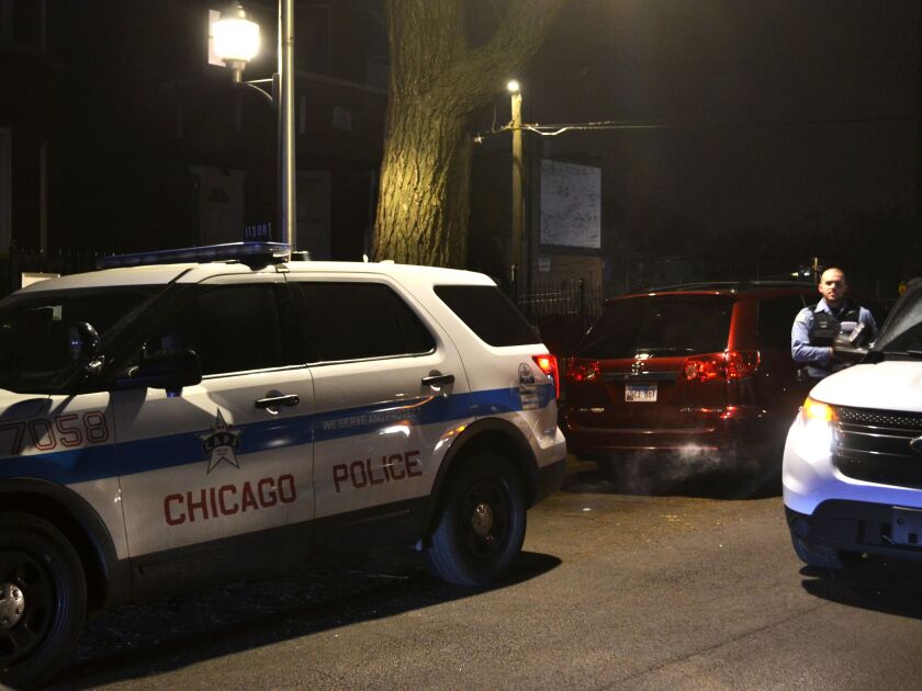 Chicago police investigate the scene where a person was shot Saturday night in the 4700 block of West Gladys, in the West Garfield Park neighborhood. | Justin Jackson/ Sun-Times