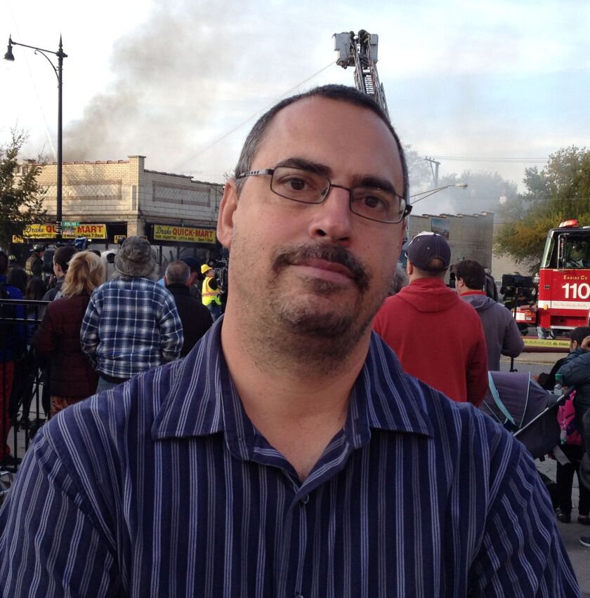 Joey Pollizze is manager of the Black Tie shop, which was among several destroyed by the blaze. | Maudlyne Ihejirika/Sun-Times